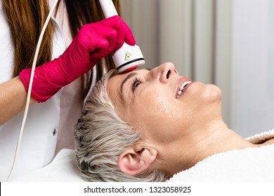 Beautiful Senior Woman Having Radio Waves Lifting Face Treatment.