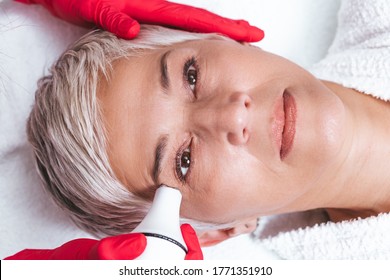 Beautiful Senior Woman Having Radio Waves Lifting Face Treatment.