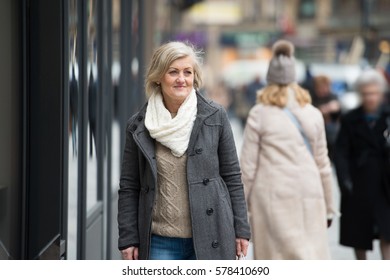 Beautiful Senior Woman On A Walk In The City. Winter