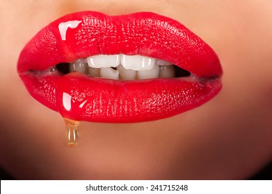 beautiful sensual lips with honey closeup