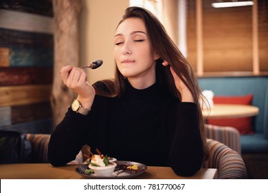 Beautiful Sensual Woman With Dark Chocolate Hair Eating Brownie Cake Dessert In Cafe With Great Pleasure