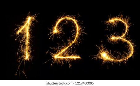 Beautiful Set Of Fireworks Numbers 1,2,3 Close Up. Burning Sparkler Numbers Isolated On Black Background. Numbers Of Sparklers To Overlay A Texture For Design Holiday Postcards, Web Banners