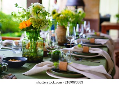beautiful setting of a large table with flowers. original elements of banquet table decoration. - Shutterstock ID 2189093583