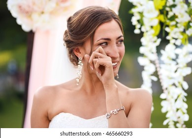 Beautiful Sexy Bride In White Dress Weeps.  Tears Of Happiness On The Wedding Day. 
