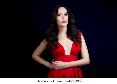 Beautiful Sexy Brunette With Red Low Cut Dress