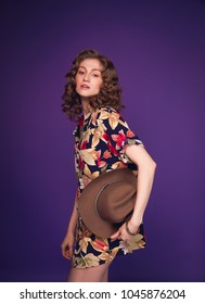 Beautiful Sexy Classy Woman Model In Colourful Dress And Cowboy Hat Full Body Portrait Purple Background Studio Natural Caucasian Makeup Attitude