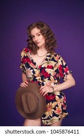 Beautiful Sexy Classy Woman Model In Colourful Dress And Cowboy Hat Full Body Portrait Purple Background Studio Natural Caucasian Makeup Attitude