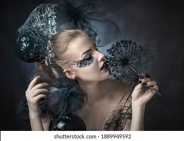 Beautiful sexy girl in black. Luxurious girl with black makeup. Lady in Black. Gothic image.lady in black