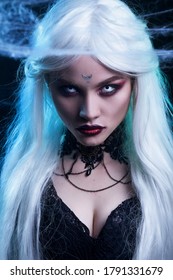 Beautiful Sexy Halloween Vampire Woman Portrait On Dark Magic Background