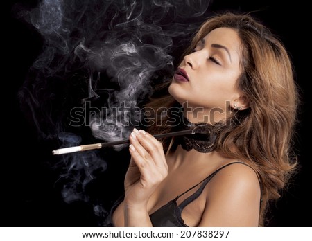 Sexy women smoking with holders