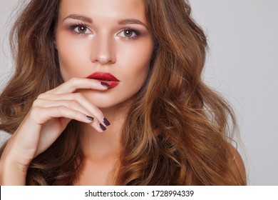 Beautiful sexy woman looking at camera  with red lips, isolated