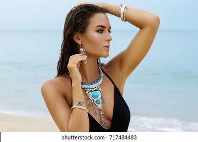 Beautiful And Sexy Woman On The Beach Wearing Silver Jewelry