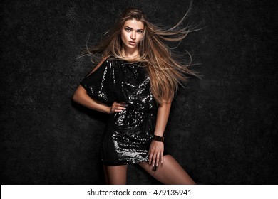 Beautiful sexy woman on black background