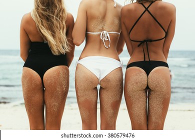 Beautiful Sexy Women in Bikinis on Tropical Sunny Beach