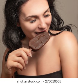 Beautiful Sexy Young Woman Eating Ice Cream.