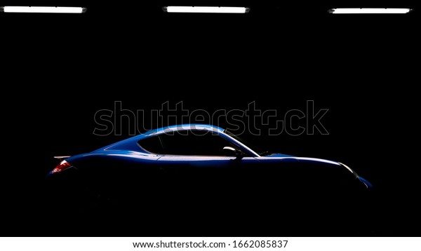 The beautiful\
shape of a sports car in the\
dark