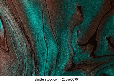 Beautiful shimmer turquoise stains liquid nail polish Stripy paint texture Nail lacquer flow background in fluid art technique Minimalism concept Copy space horizontal photography Selective focus 