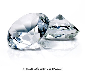 Beautiful shiny diamonds, isolated on white background. Clear or transparent diamonds, close-up shot.
