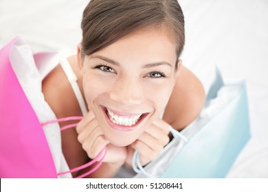 Beautiful Shopping Woman Happy Holding Shopping Bags.