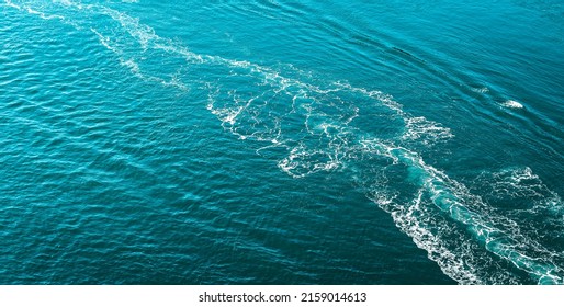 A Beautiful Shot Of A Boat Trace In The Water 