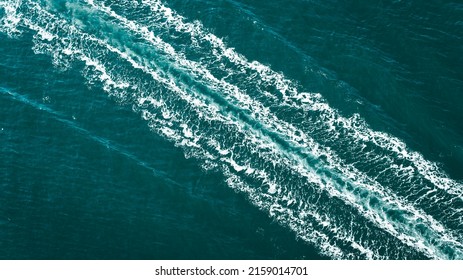 A Beautiful Shot Of A Boat Trace In The Water 