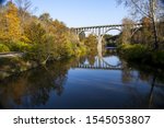 A beautiful shot of a bridge reflecting in the Cuyahoga River in Ohio on a beautiful autumn day
