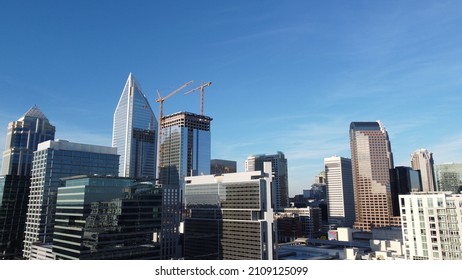A beautiful shot of the Charlotte, NC skyline under a clear blue sky