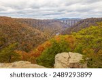 A beautiful shot of a colorful autumn landscape with a bridge in New River Gorge National Park