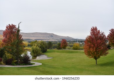 A Beautiful Shot Of A Green Park Near The Red Mountain In Washington