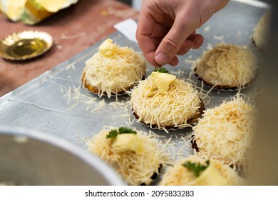 A Beautiful Shot Of A Meal Made With Cheese, Butter, And Parsley On Top Of It