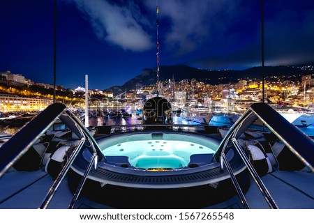 A beautiful shot of a night view full of lights and adventure from a private yacht