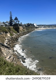 Beautiful shot on West Cliff Drive in Santa Cruz, California, with the famous Dream Inn hotel spotted in the back.