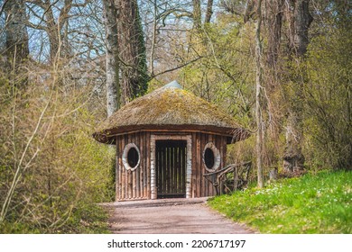 A Beautiful Shot Of A Small Hobbit House In A Forest During The Day