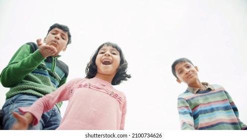 A Beautiful Shot Of South Asian Children Playing In A Backyard