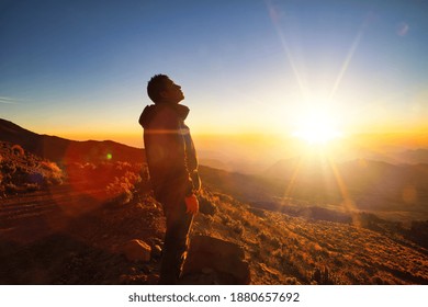 A beautiful shot of sunrise a male standing in sierra negra Volcano in Mexico - Shutterstock ID 1880657692