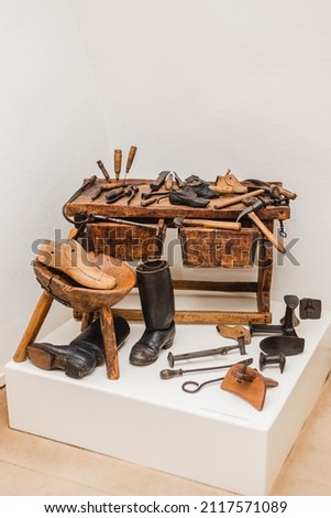 A beautiful shot of a vintage boot making tools of a cobbler