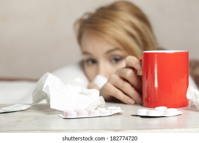 Beautiful Sick Woman In Bed Taking Medicine