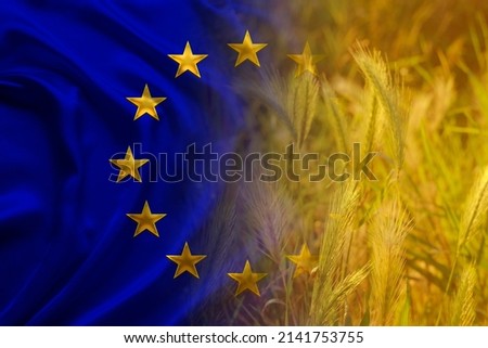 beautiful silk background, flag of European Union, golden ripe ears of wheat, concept of rich harvest of bread, grain import, export abroad, stock exchange, grain trading, Grains Futures Prices