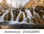 Beautiful, silky waterfalls between the lakes in the Plitvice national park, Croatia during winter season