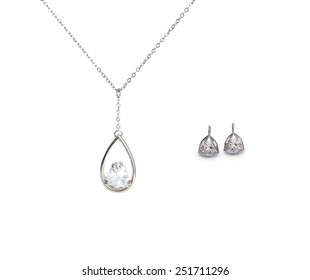 Beautiful Silver Necklace And Diamond Earrings Isolated On White Background