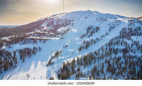 Beautiful Pyhätunturi ski resort in the sun in early spring when skiing season is on it best