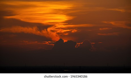Beautiful sky with cloud after sunset background, scenery of dramatic sky in evening, blue, grey, orange, golden light in twilight, looks like watercolor painting.