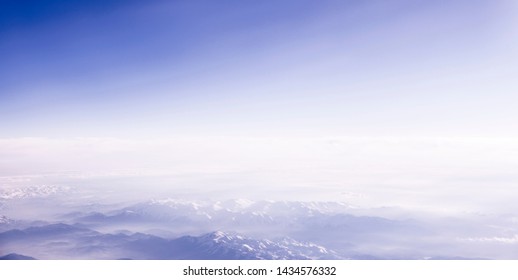 Beautiful Sky And Clouds. Eart View From Airplane. Mountains.