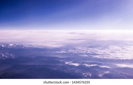 Beautiful Sky And Clouds. Eart View From Airplane. Mountains.