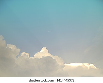 Beautiful sky with clouds and translucent sun. 