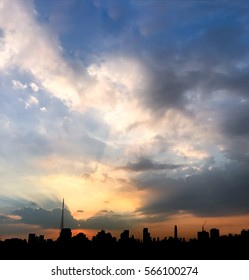 Beautiful Sky With Sun  Rays With Was Hidden From Clouds And  Sillhouette City Background