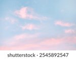 A beautiful sky tinted by the sun leaving vibrant shades of gold, pink, blue and multicolored. Clouds in the twilight evening and morning sky. Cloudy sky background in the evening, and during the day.