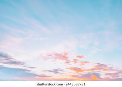 A beautiful sky tinted by the sun leaving vibrant shades of gold, pink, blue and multicolored. Clouds in the twilight evening and morning sky. Cloudy sky background in the evening and during the day. - Powered by Shutterstock