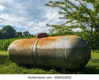 A Beautiful Sky View Beyond The Old Propane Tank.