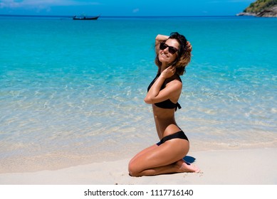 Beautifull girl changing on beach